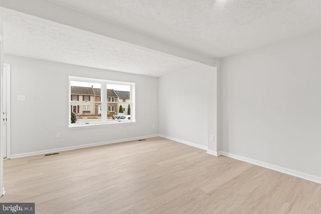 14743 Winding Loop Woodbridge, VA 22191 - Photo 6 of 36 a view of an empty room with a window