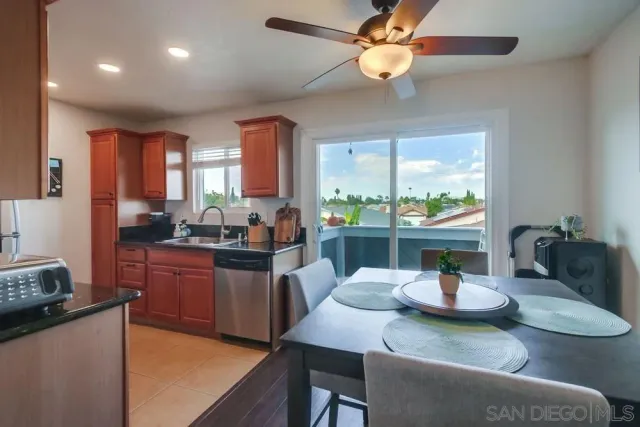 a kitchen with a dining table and chairs