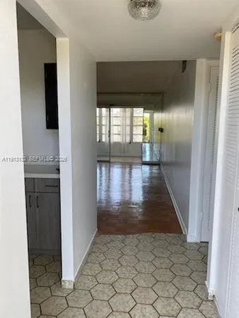 a view of empty room with windows