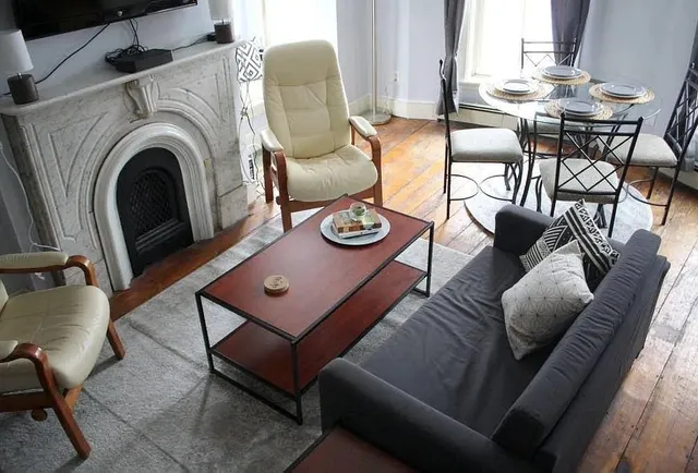 a living room with furniture and a table