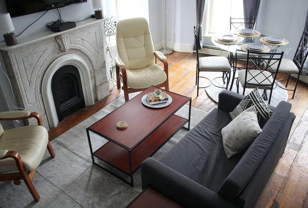 231 Shawmut Avenue, Unit 1 Boston, MA 02118 - Photo 13 of 20 a living room with furniture and a table