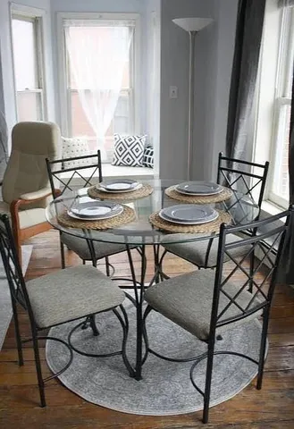 a view of a dining room with furniture window and outside view