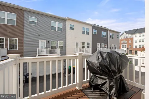 a view of a chairs and a table in the patio