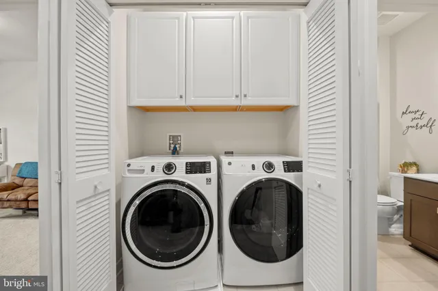 a utility room with dryer and washer