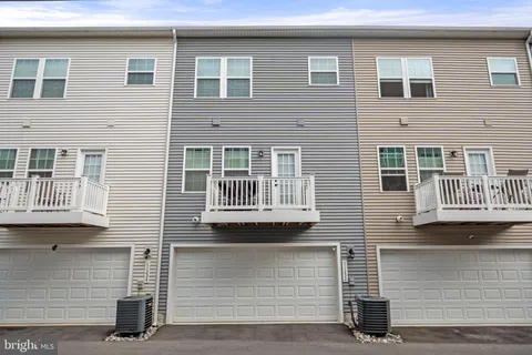 a front view of a building with a street