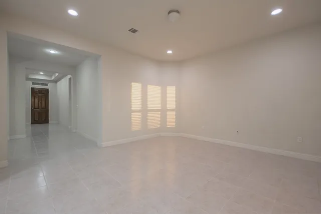 a view of large kitchen with a sink and stainless steel appliances