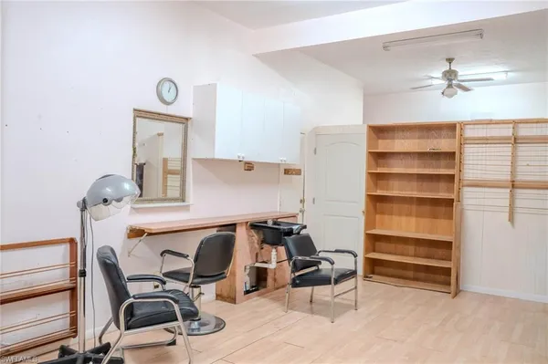 a workspace with furniture and wooden floor