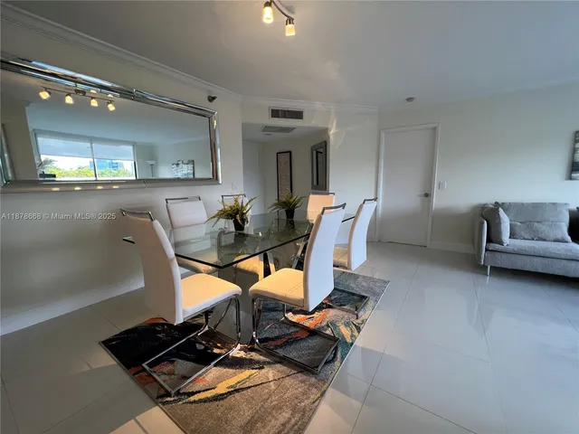 a room with furniture a rug and gym equipment