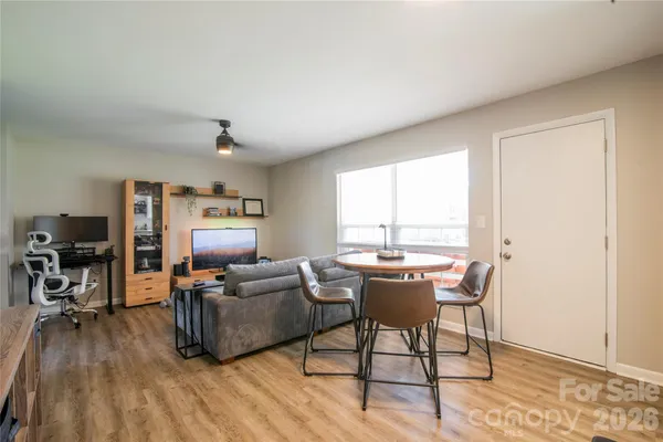 a workspace with furniture hardwood and a window