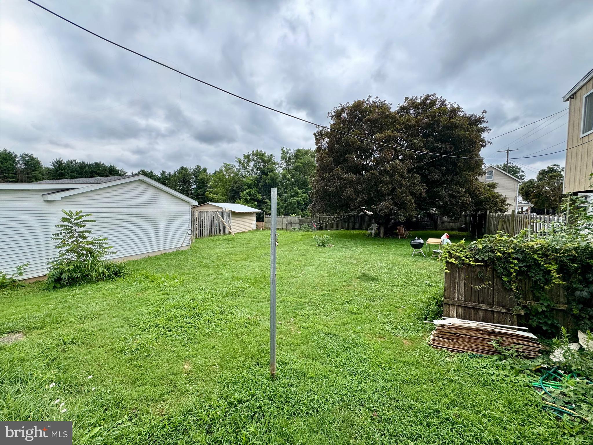 21525 York Road Freeland, MD 21053 - Photo 2 of 5 a backyard of a house with lots of green space and lake view