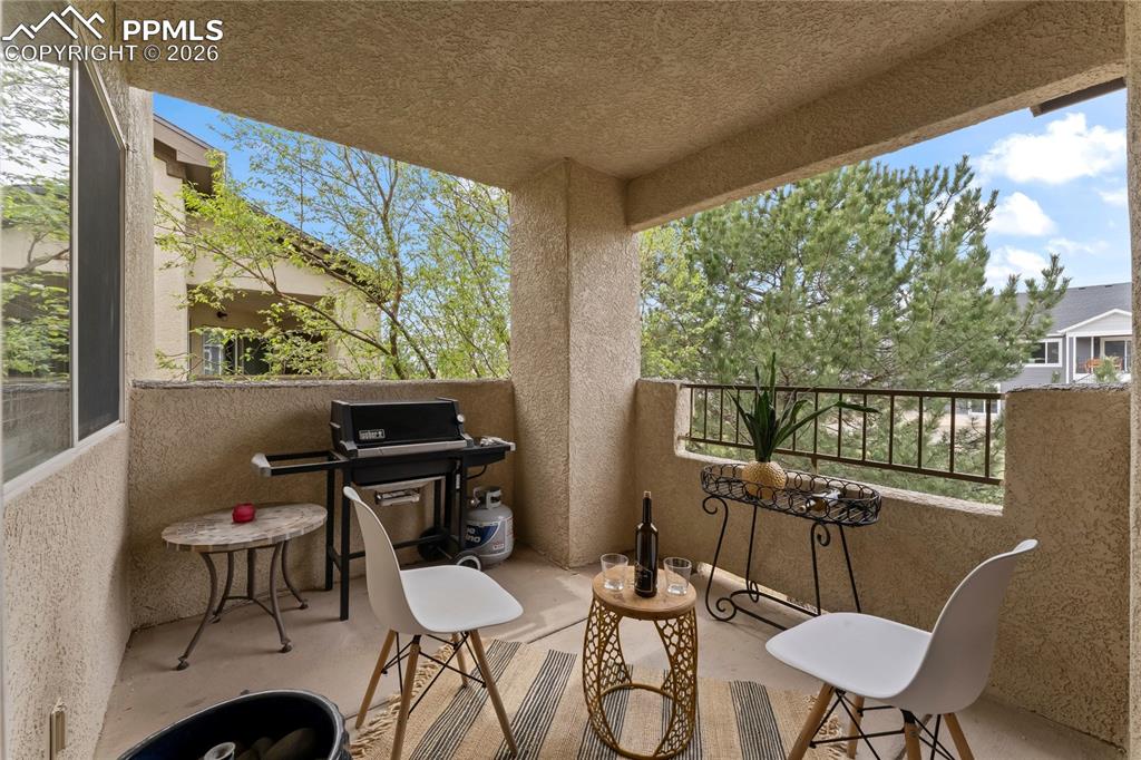 3976 Riviera Grove, Unit 203 Colorado Springs, CO 80922 - Photo 39 of 45 a view of a dining room with furniture window and outside view