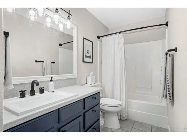 a bedroom with a bed and with furniture