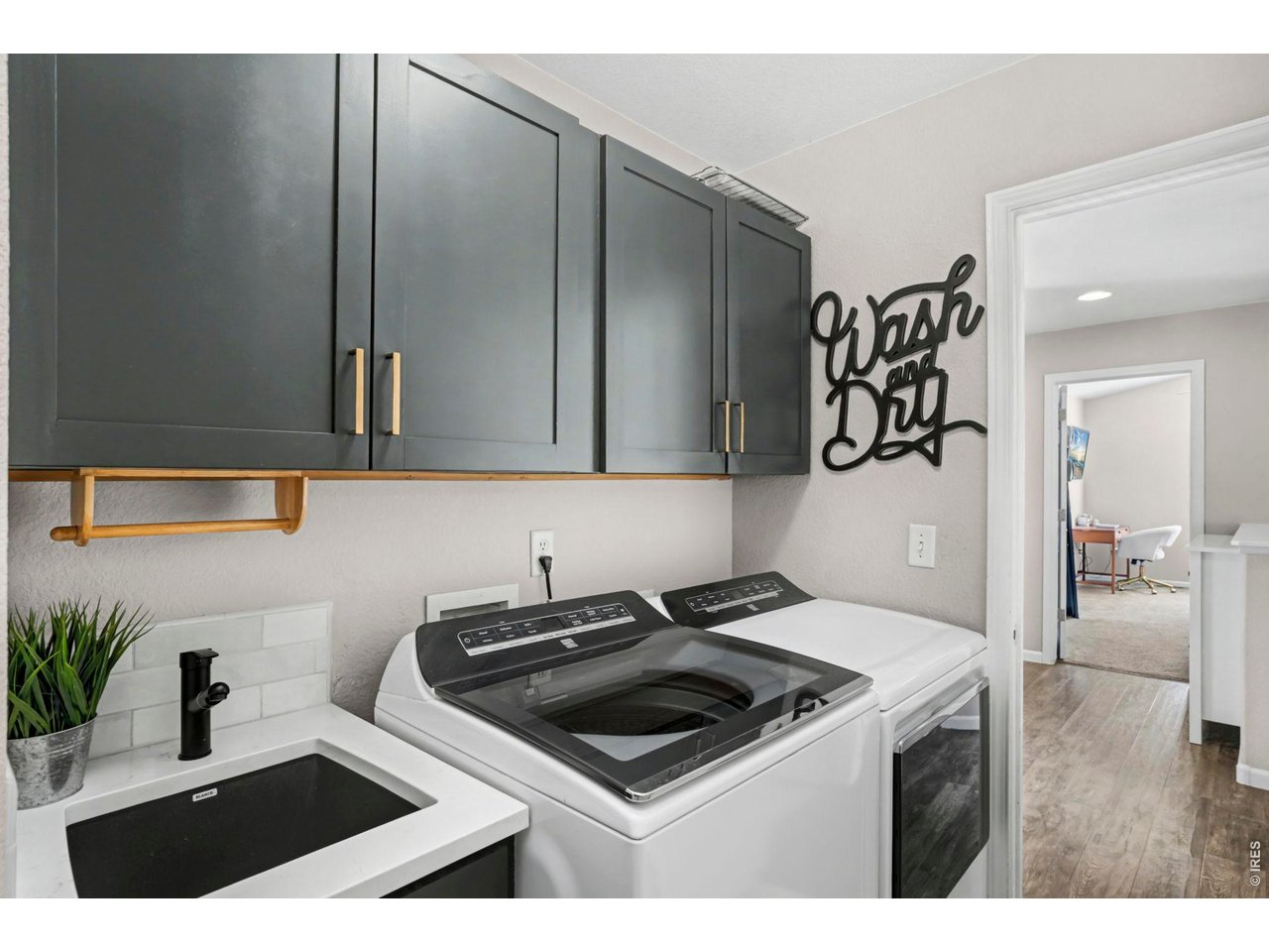 1313 Park Ridge Drive Severance, CO 80615 - Photo 23 of 43 Remodeled main level laundry with wet sink