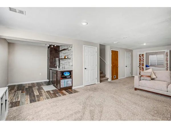 a living room with furniture and a table