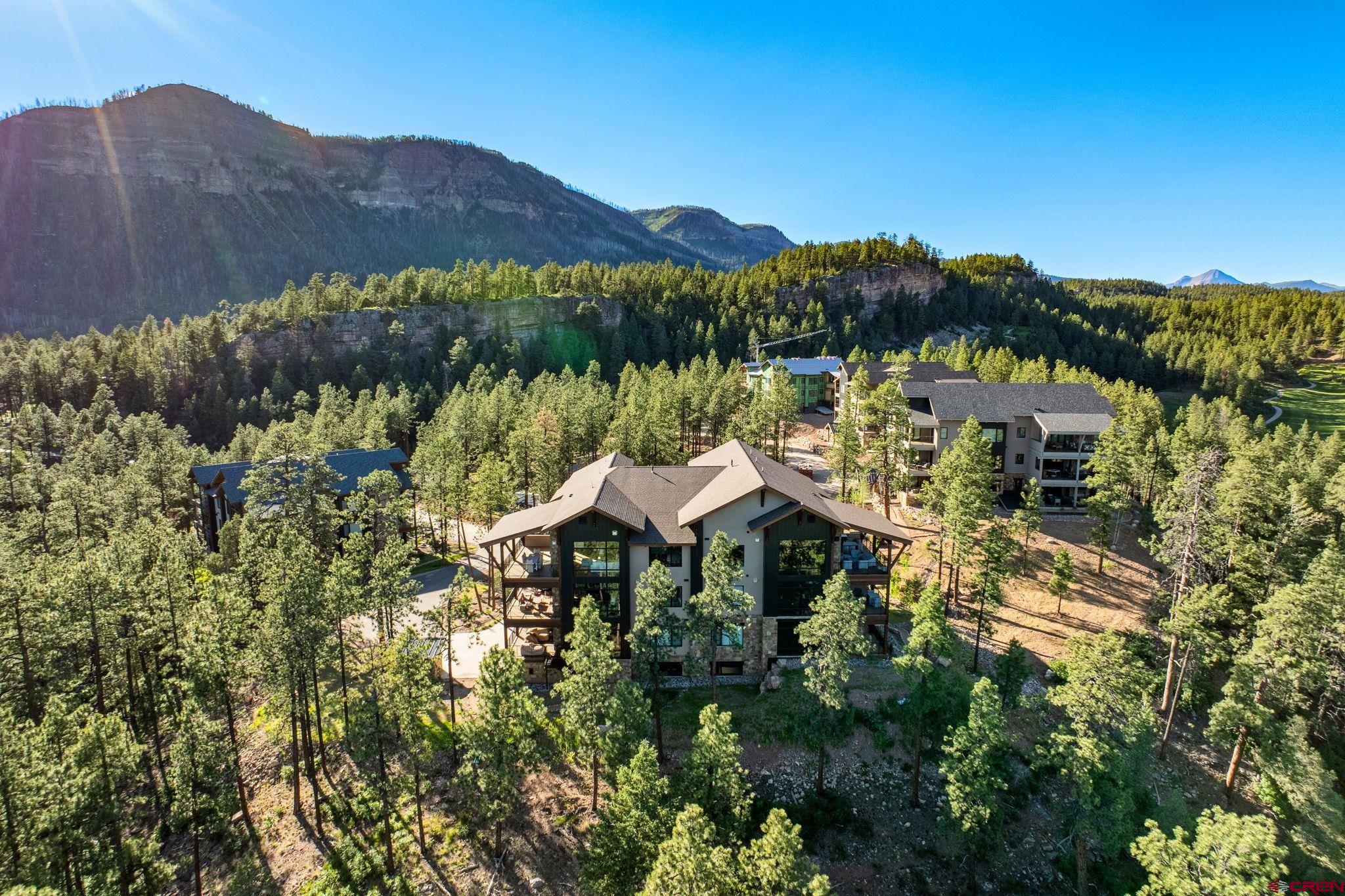 a view of a lake in middle of forest