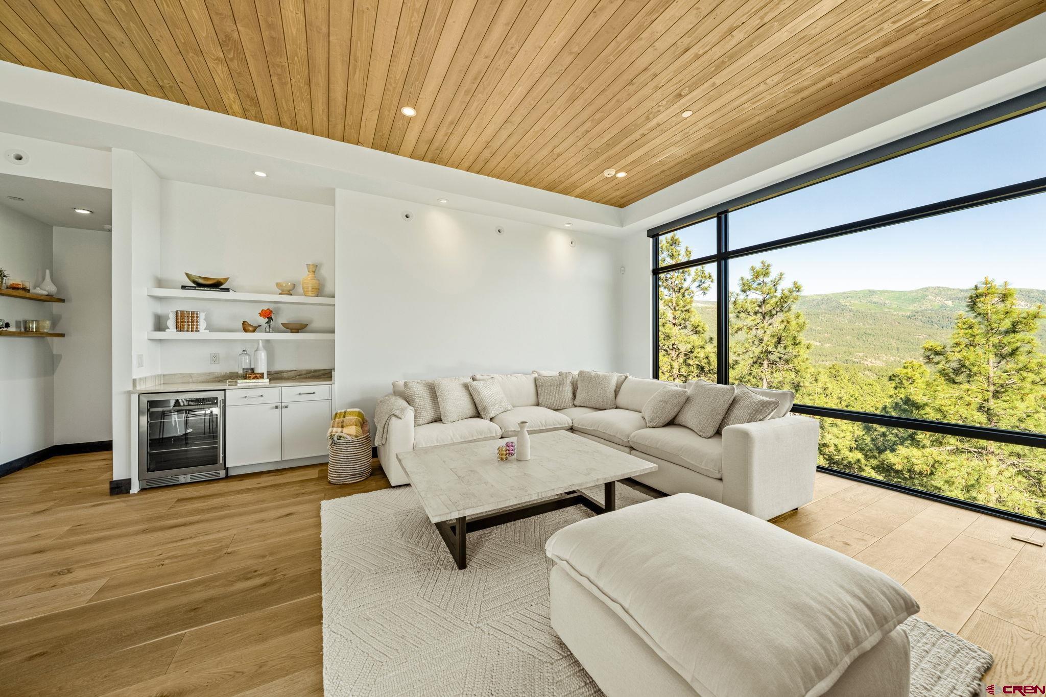 136 Outlaw Drive, Unit 3B Durango, CO 81301 - Photo 12 of 45 a living room with furniture and a large window