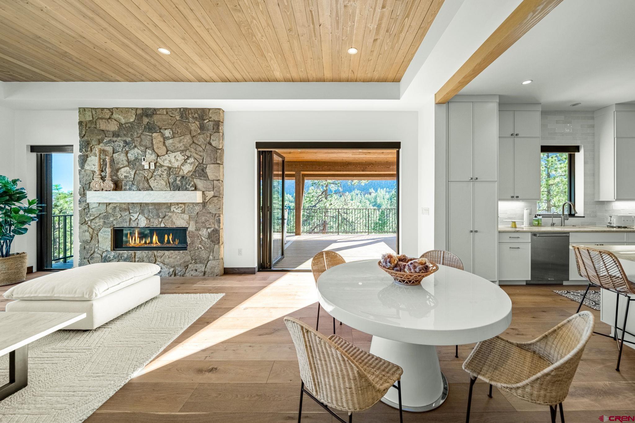 136 Outlaw Drive, Unit 3B Durango, CO 81301 - Photo 14 of 45 a living room with fireplace furniture and a large window