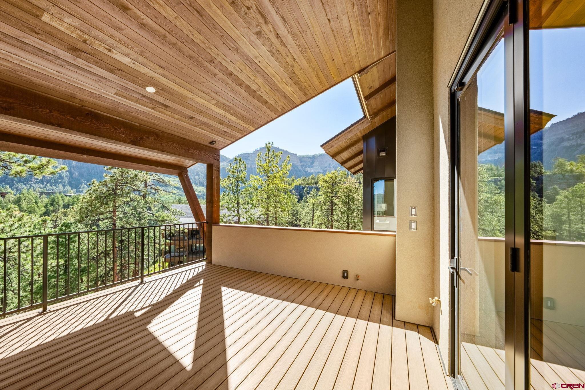 136 Outlaw Drive, Unit 3B Durango, CO 81301 - Photo 19 of 45 a view of a room with wooden floor and iron stairs