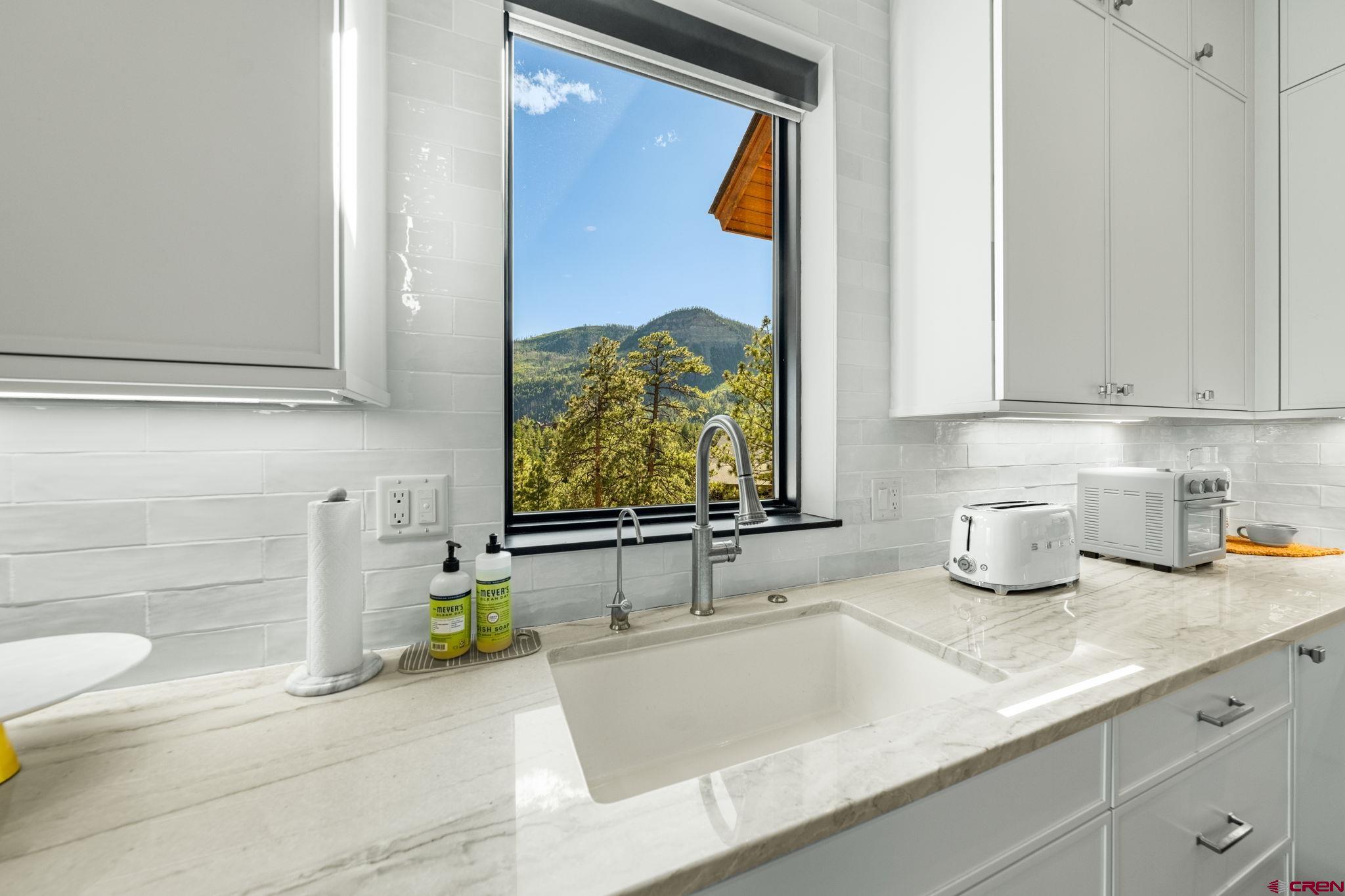 136 Outlaw Drive, Unit 3B Durango, CO 81301 - Photo 21 of 45 a bathroom with a sink and a mirror