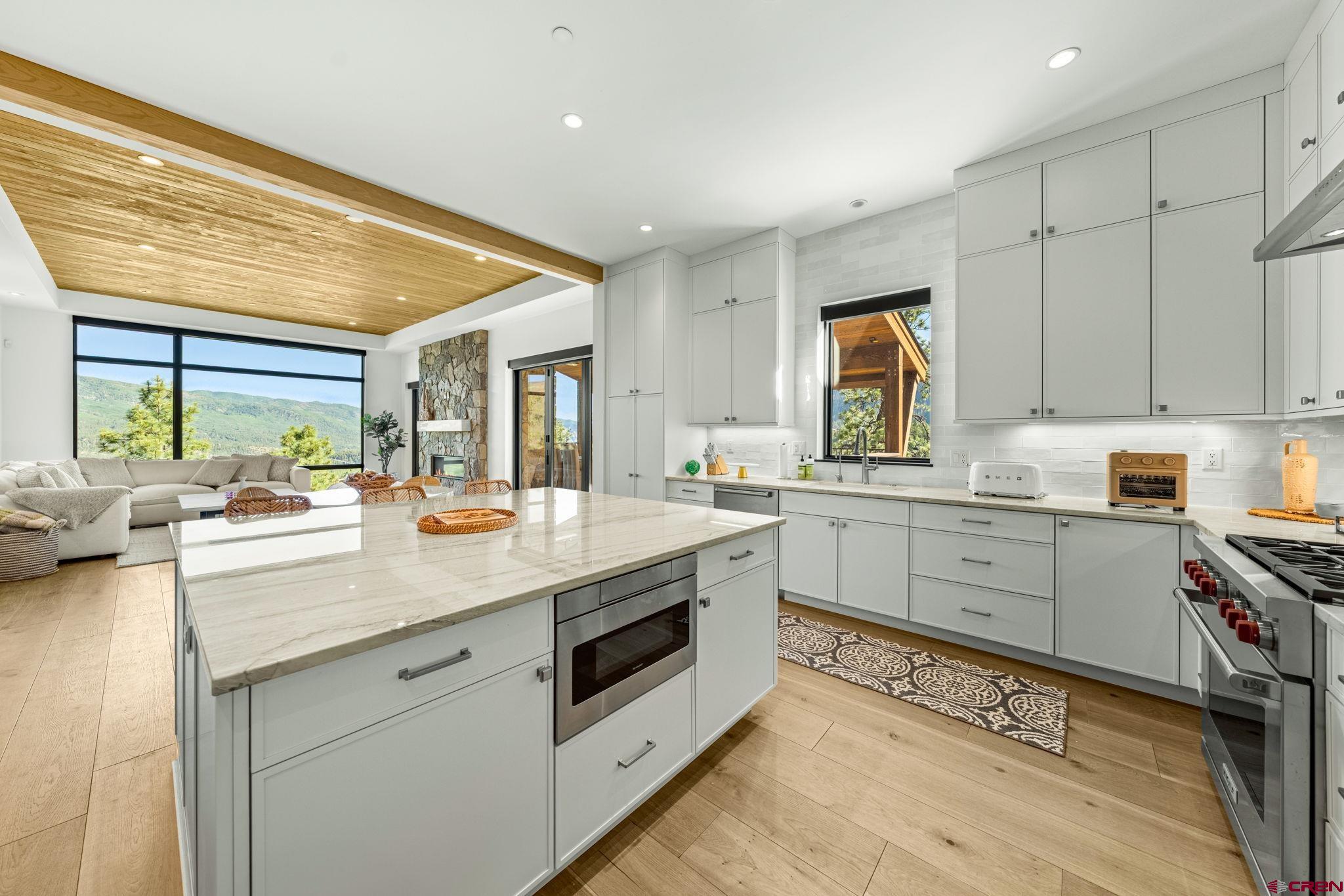 136 Outlaw Drive, Unit 3B Durango, CO 81301 - Photo 24 of 45 a kitchen with a sink stove and cabinets