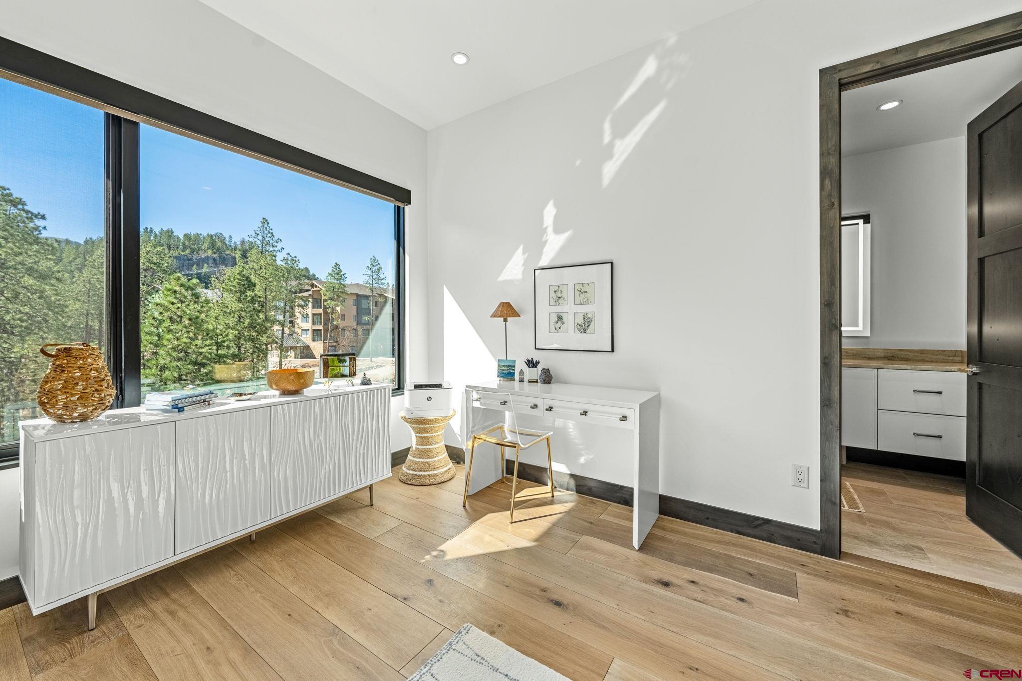 136 Outlaw Drive, Unit 3B Durango, CO 81301 - Photo 36 of 45 a living room with furniture and a large window