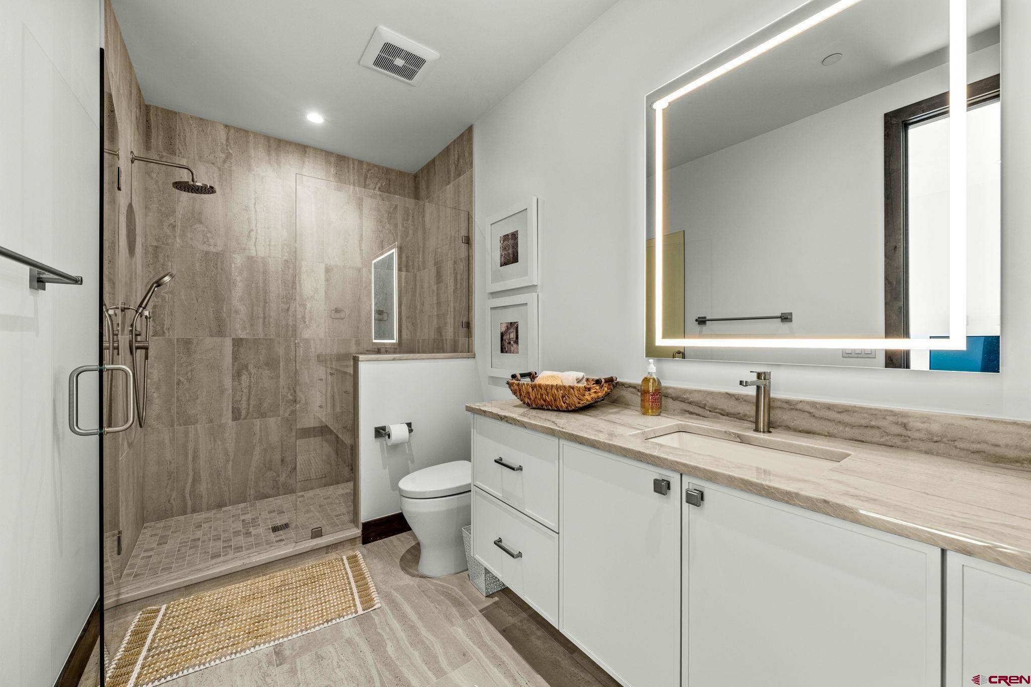 136 Outlaw Drive, Unit 3B Durango, CO 81301 - Photo 37 of 45 a bathroom with double sink and a mirror