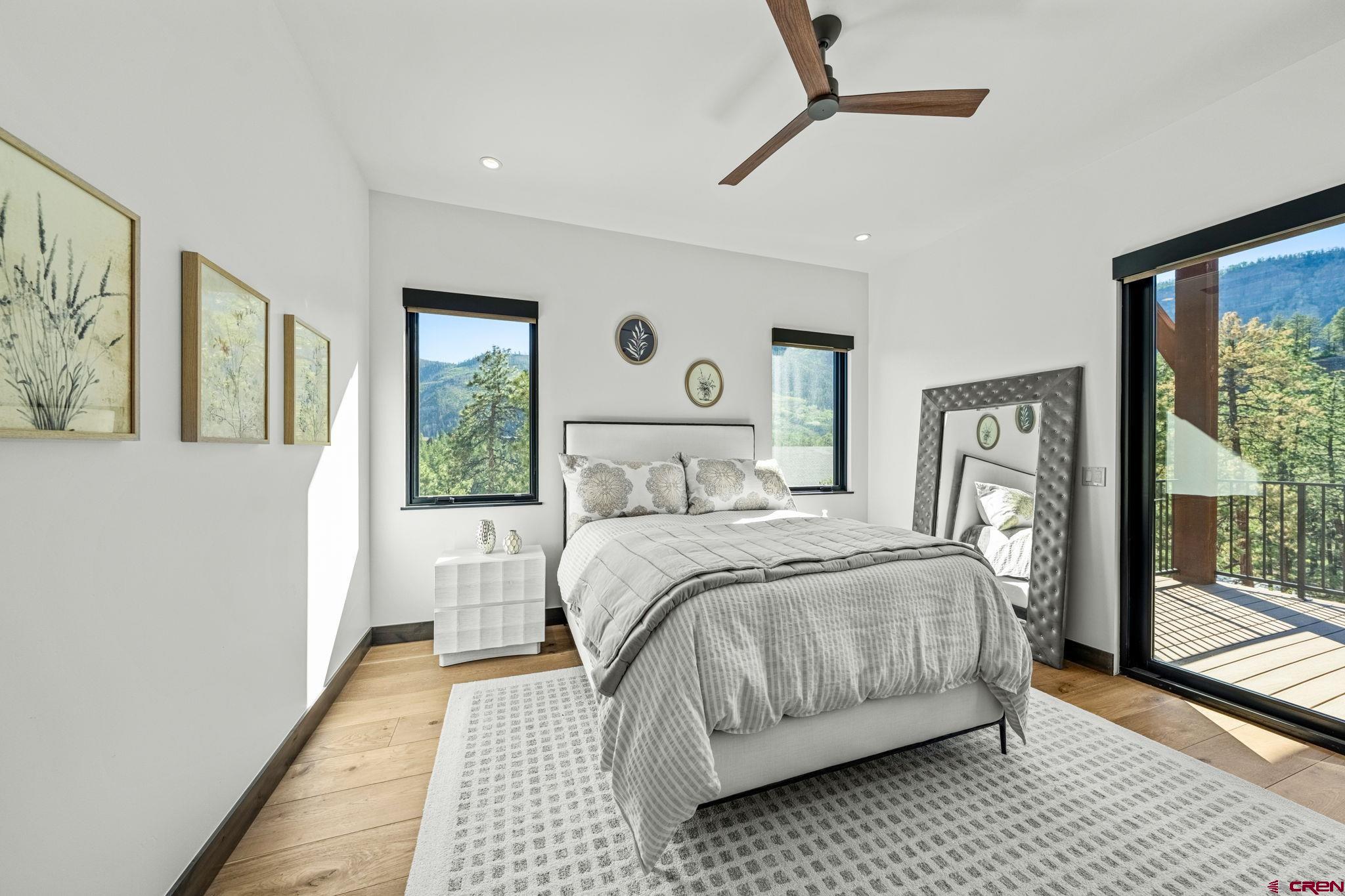 136 Outlaw Drive, Unit 3B Durango, CO 81301 - Photo 38 of 45 a bedroom with a large bed and a window