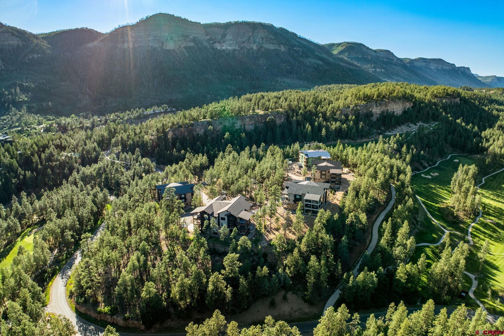 136 Outlaw Drive, Unit 3B Durango, CO 81301 - Photo 4 of 45 a view of a lush green hillside and a building