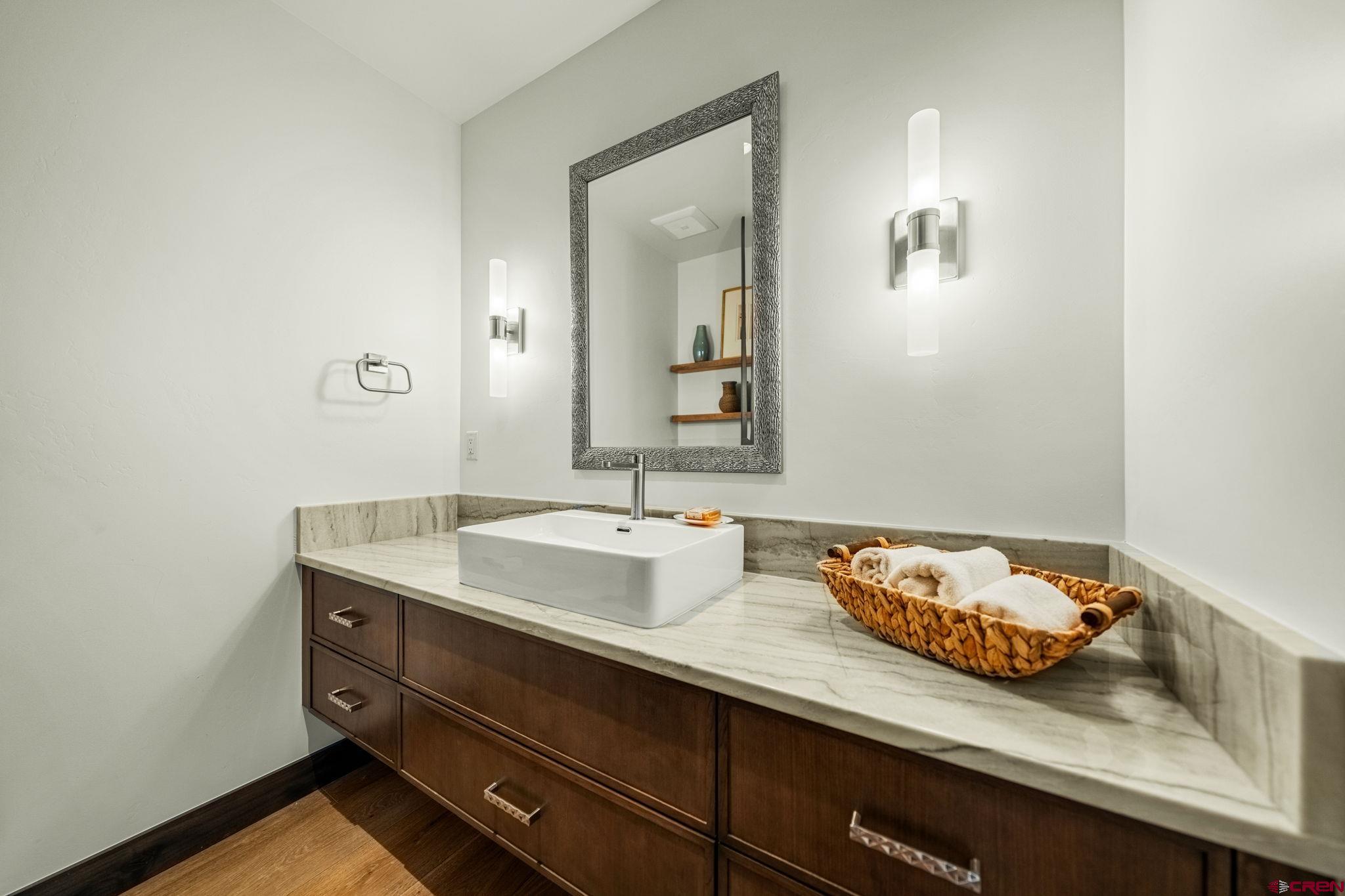 136 Outlaw Drive, Unit 3B Durango, CO 81301 - Photo 41 of 45 a bathroom with a granite countertop sink and a mirror
