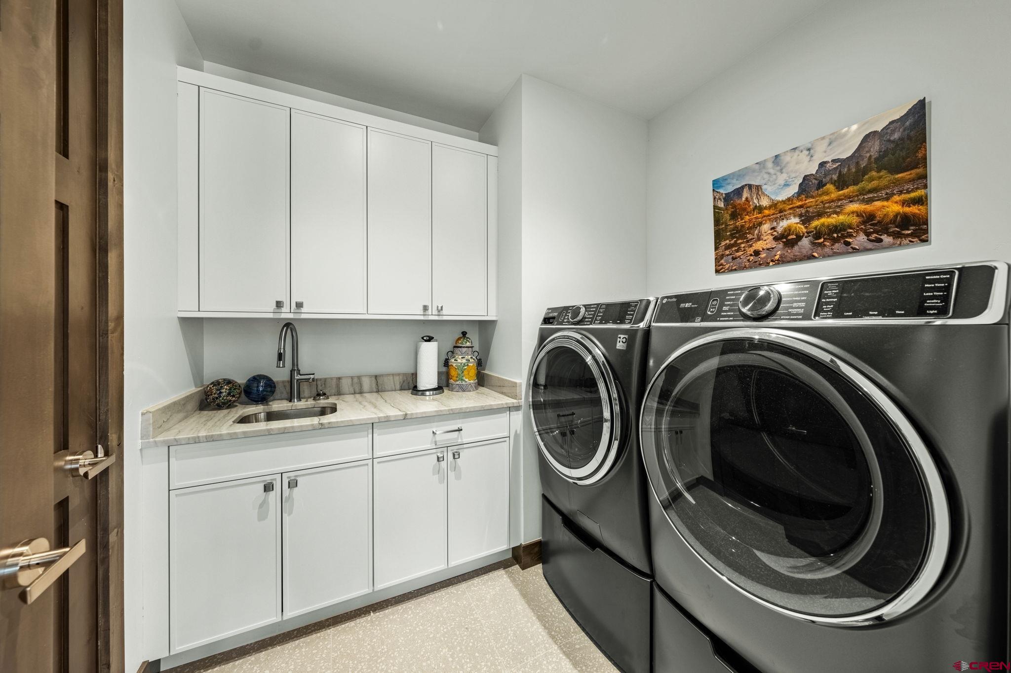 136 Outlaw Drive, Unit 3B Durango, CO 81301 - Photo 42 of 45 a utility room with sink dryer and washer