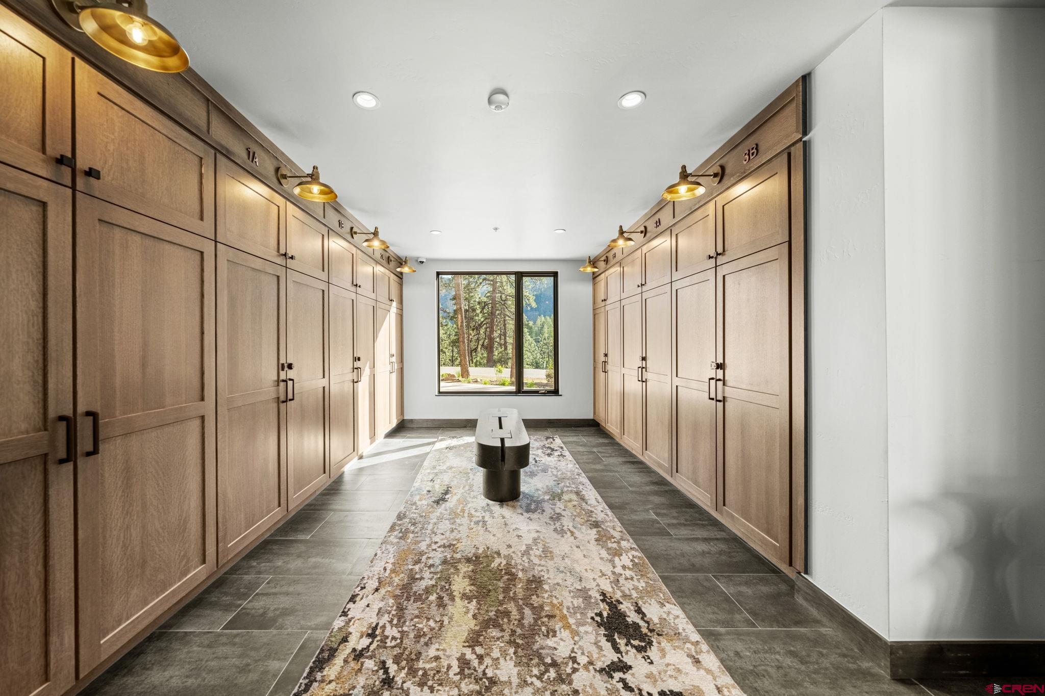 136 Outlaw Drive, Unit 3B Durango, CO 81301 - Photo 43 of 45 a hallway with white doors wooden floor and glass door