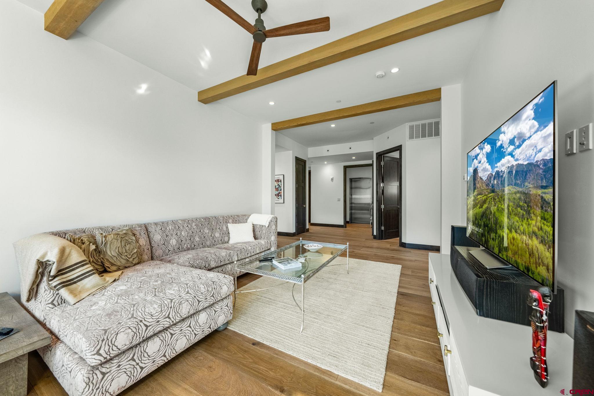 136 Outlaw Drive, Unit 3B Durango, CO 81301 - Photo 9 of 45 a living room with furniture and a flat screen tv