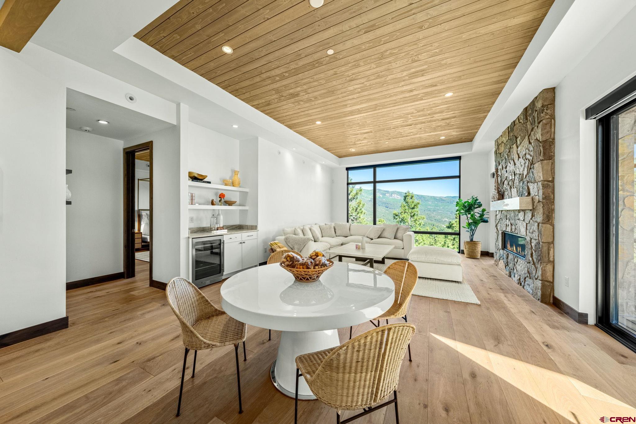 136 Outlaw Drive, Unit 3B Durango, CO 81301 - Photo 10 of 45 a dining room with furniture and a floor to ceiling window