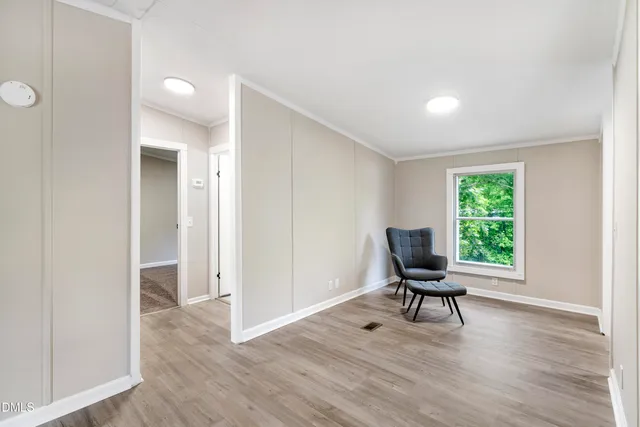 a workspace room with furniture and a window