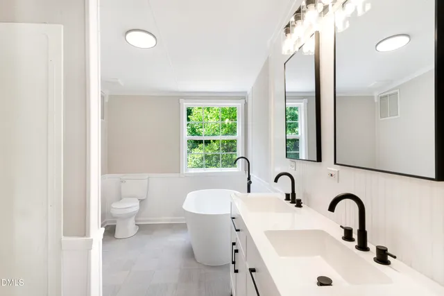 a bathroom with a sink and a large mirror