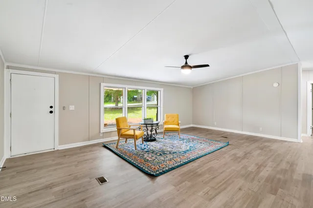 a living room with dining area and a table