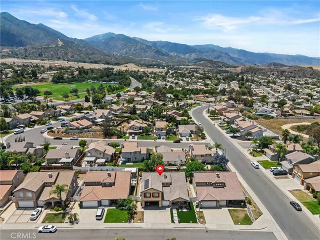 an aerial view of residential houses and street