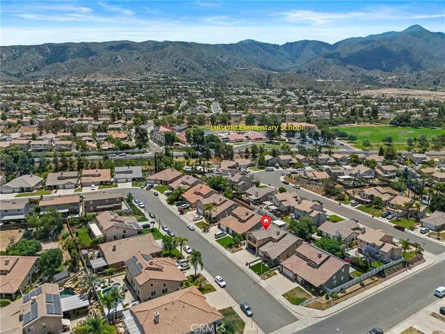 an aerial view of residential houses with outdoor space