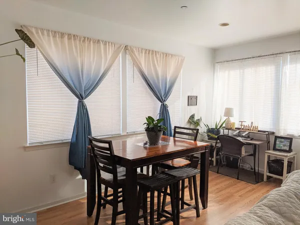 a view of a dining room with furniture and window