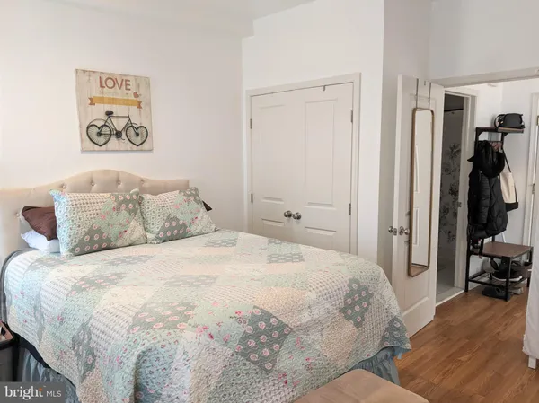 a bedroom with a bed and a view of bedroom