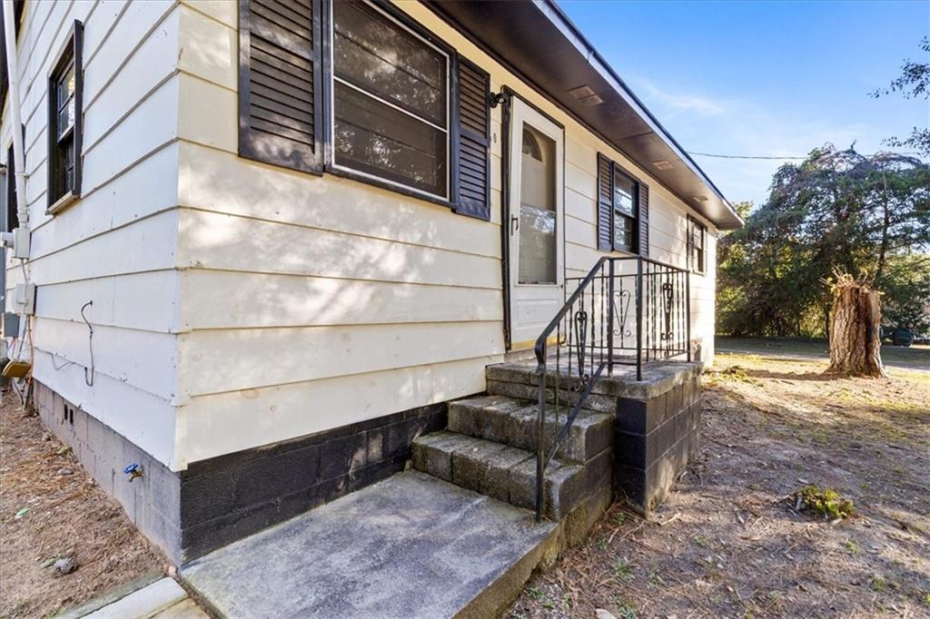 50 Evelyn Road Covington, GA 30016 - Photo 12 of 23 a view of a house with a wooden deck