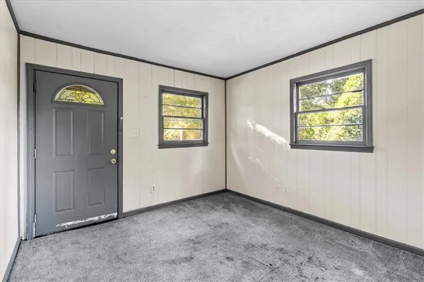 a kitchen with a refrigerator and window