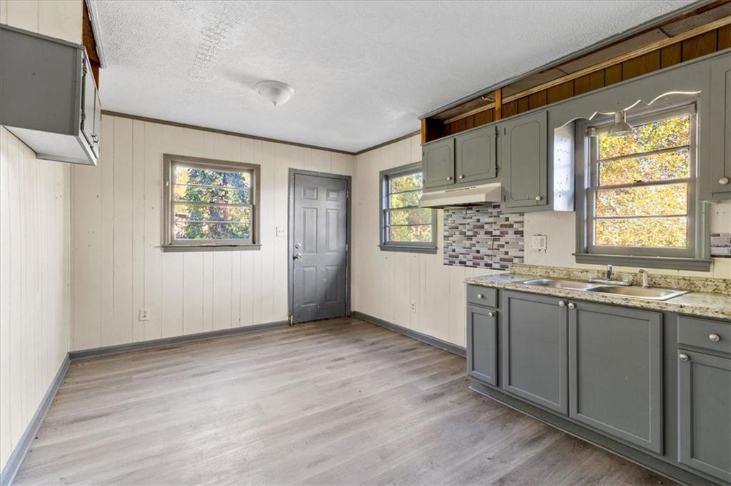 50 Evelyn Road Covington, GA 30016 - Photo 16 of 23 a kitchen with stainless steel appliances granite countertop a stove a sink and a refrigerator