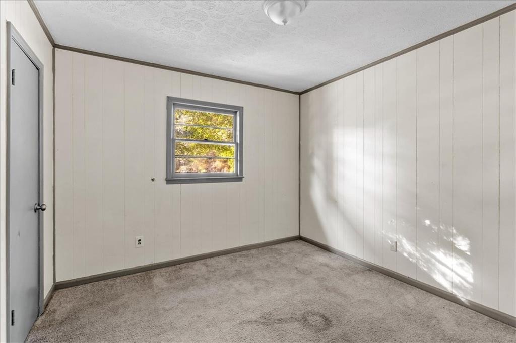 50 Evelyn Road Covington, GA 30016 - Photo 19 of 23 a view of an empty room with a window