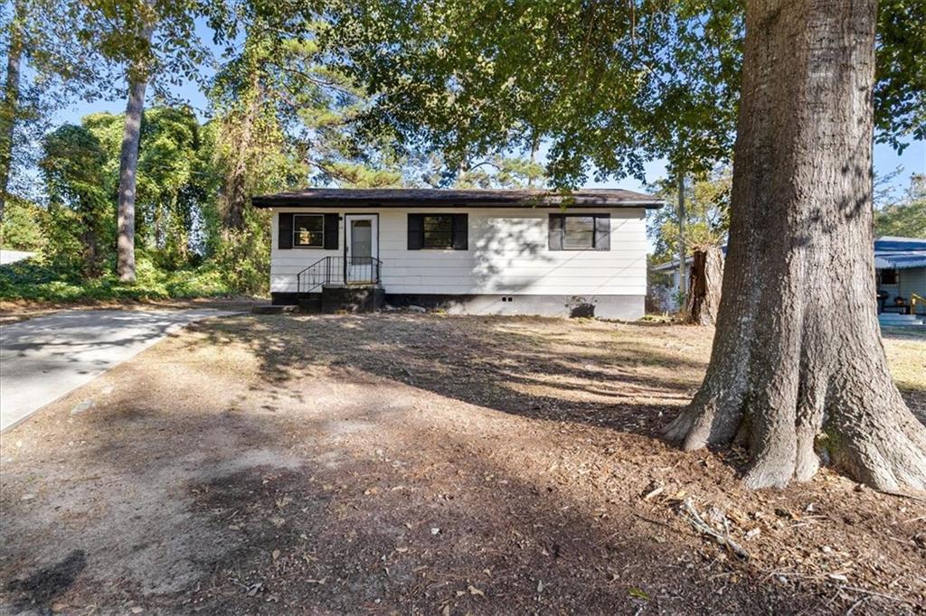50 Evelyn Road Covington, GA 30016 - Photo 2 of 23 a view of a house with a yard