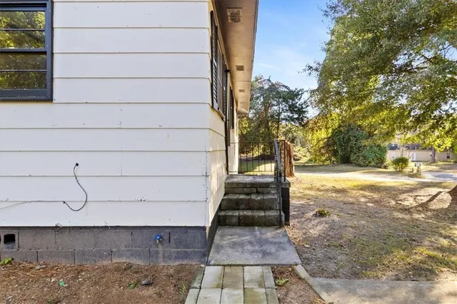 a view of a yard with wooden stairs