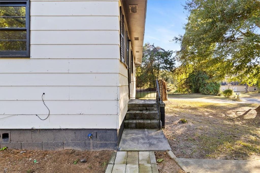 50 Evelyn Road Covington, GA 30016 - Photo 6 of 23 a view of a yard with wooden stairs