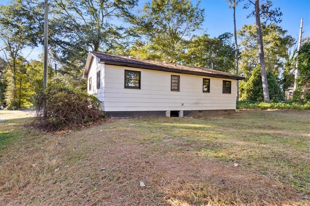 50 Evelyn Road Covington, GA 30016 - Photo 10 of 23 a view of a house with a yard