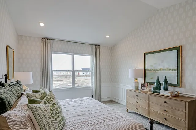 a bedroom with a bed and a couch