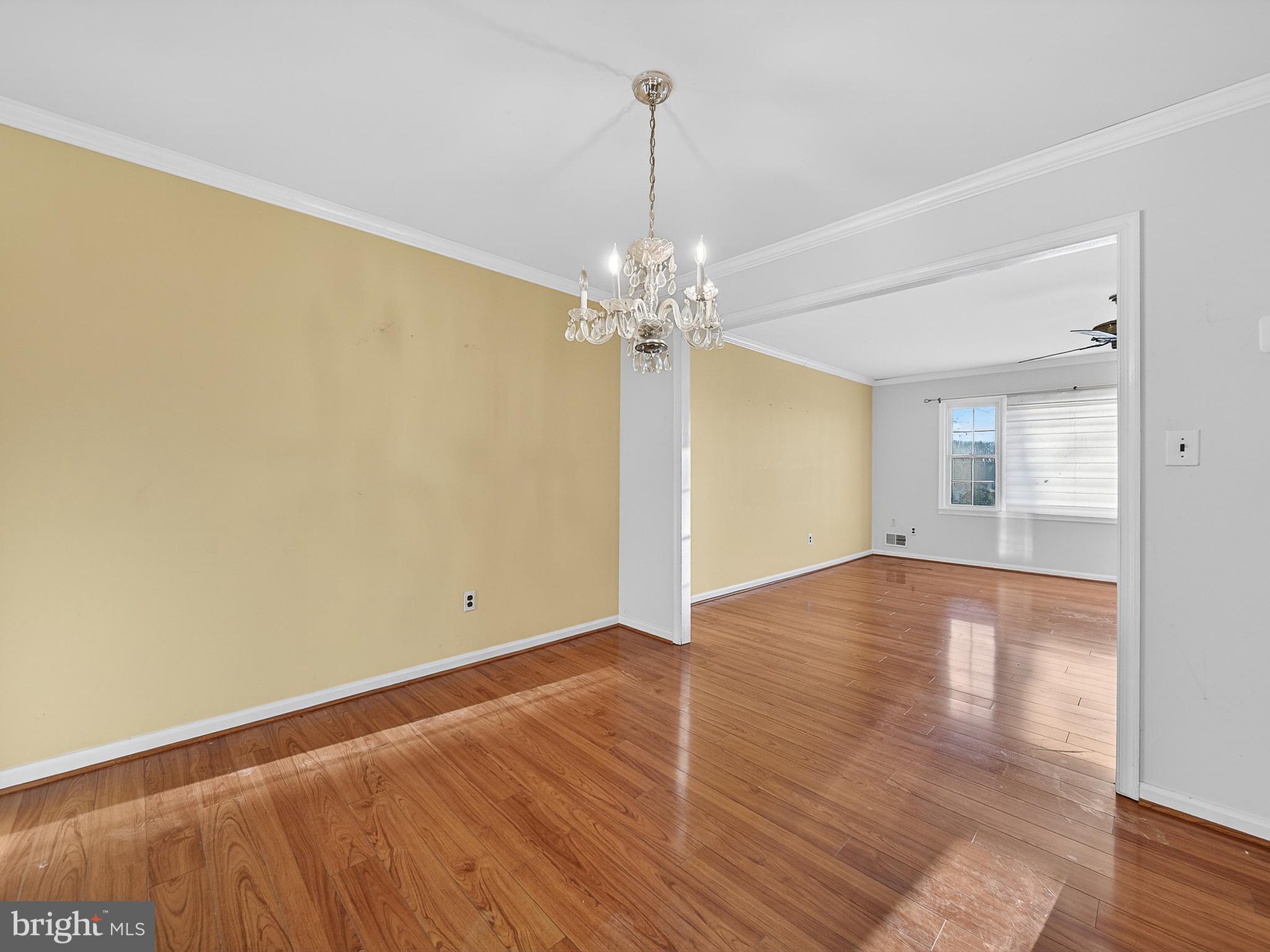 9315 Lees Ridge Road Warrenton, VA 20186 - Photo 15 of 51 a view of a room with wooden floor and chandelier